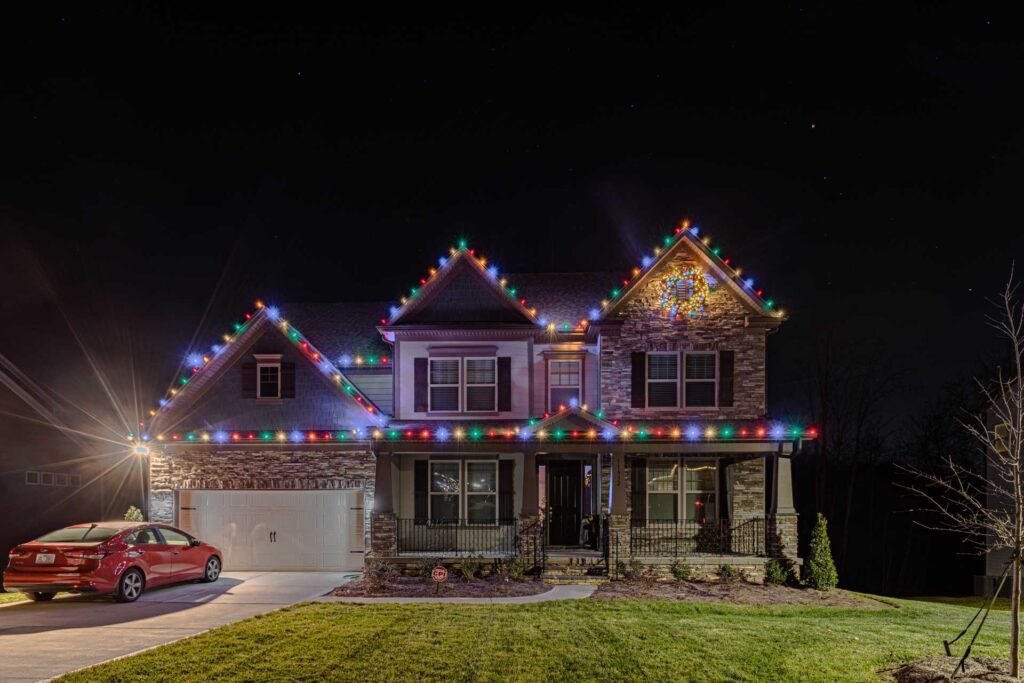 Colorful Christmas light installation on a home